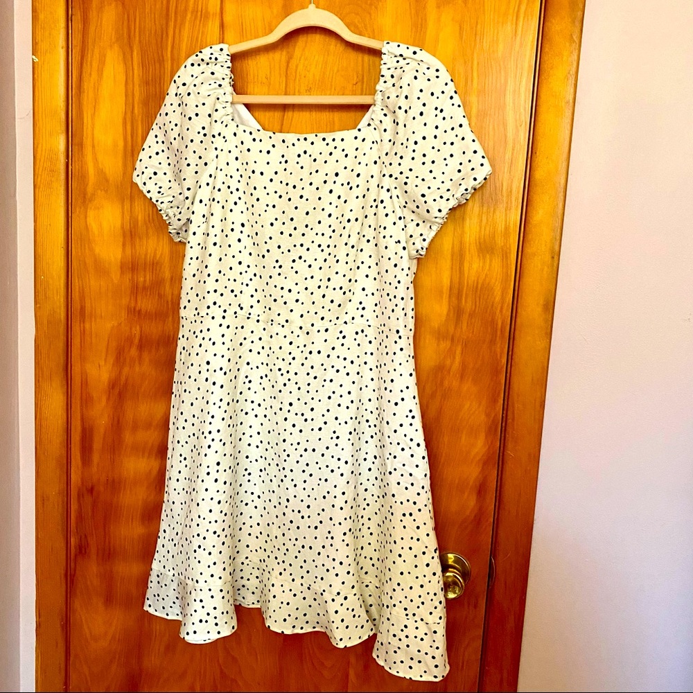 White dress with black polka dots with open back